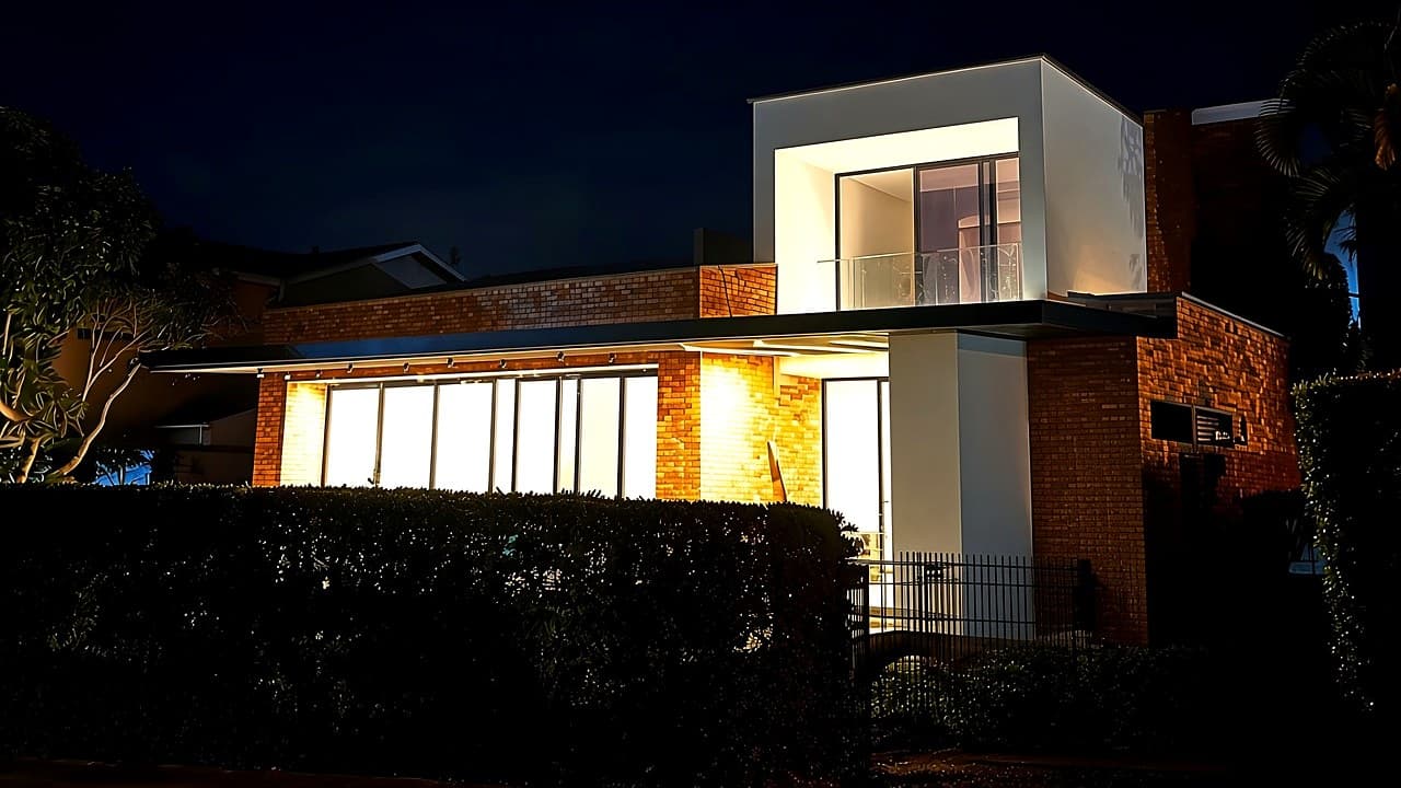Contemporary house lit at night in Bahía Ruitoque, Santander